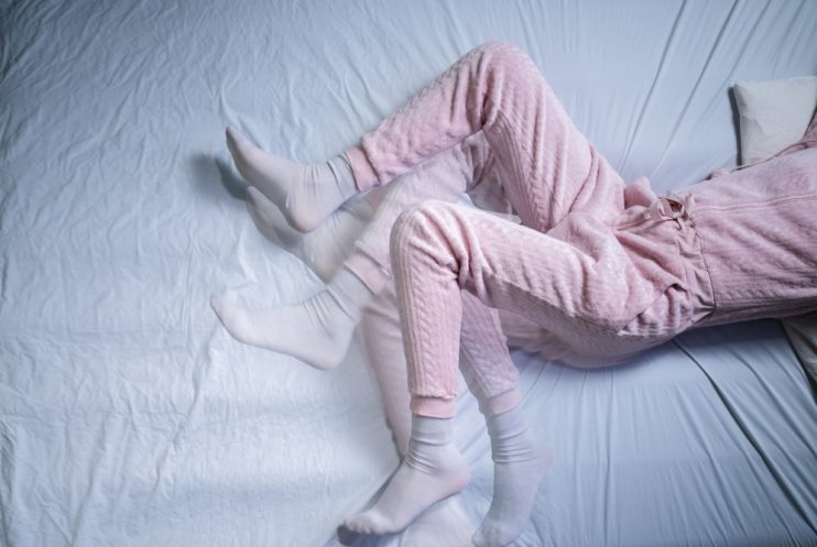 African,American,Woman,With,Rls,-,Restless,Legs,Syndrome.,Sleeping